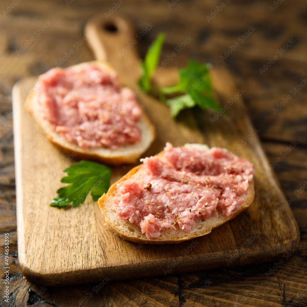 Traditional pork pate or sausage on a white bread Traditional pork pate or sausage on a white bread
