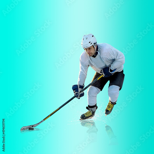 Photography Professional ice hockey player hitting puck for winning goal in action on gradient multicolored neon background