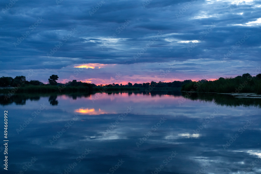 Sunset on the Okavango River between Namibia and Angola