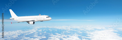 Panoramic wide angle view of sky horizon with clouds and jet commercial liner flying.