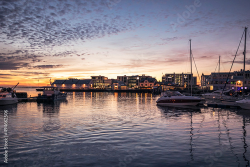 view of the harbor of Ålesund in Norway at sunset