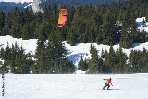 Kite Skiing. photo during the day in a beautiful winter setting.