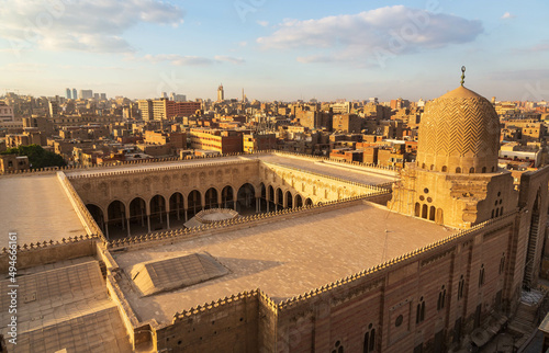 Cairo, Egypt - January 2022: Panoramic city view on the medieval mosque Mosque of Sultan al-Mu'ayyad in old city maked from top of Bad Zuweila gate