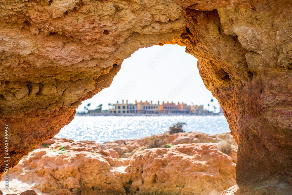 Fototapeta premium Beautiful sandstone arch with the view on marina in Portimao, Ferragudo, Algarve, Portugal