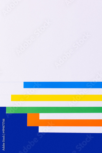 light violet background with multicolored paper stripes.