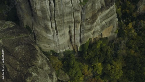 Aerial view over the Varlaam cloister, in Meteora, Greece - tilt, drone shot photo