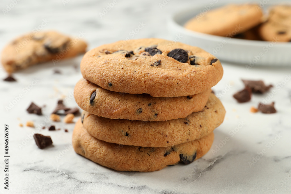Delicious chocolate chip cookies on white marble table Delicious chocolate chip cookies on white marble table