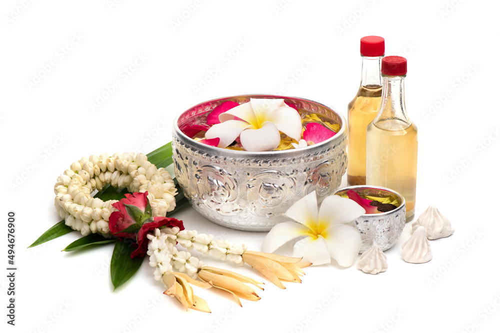 Garland flowers , water with flower and  scented water isolated on white background. Use for Songkran festival in Thailand.