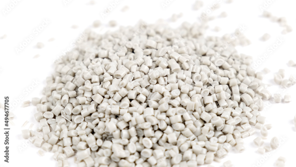 Secondary granule made of polypropylene, white Plastic pellets crumbles to the table. Plastic raw materials in granules for industry. Polymer resin. Raw plastic recycling concept Secondary granule made of polypropylene, white Plastic pellets crumbles to the table. Plastic raw materials in granules for industry. Polymer resin. Raw plastic recycling concept