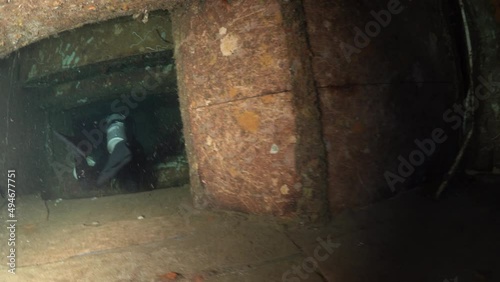 Wallpaper Mural Scuba divers swims on the Shipwreck Swedish ferry MS Zenobia. Wreck diving. Mediterranean sea, Cyprus. Maritime disasters. Underwater 4K video filming Shot Of Sunken Ship. World tragedies under water Torontodigital.ca