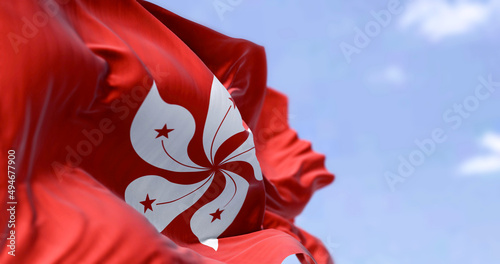 Detail of the civil flag of Hong Kong waving in the wind on a clear day. photo