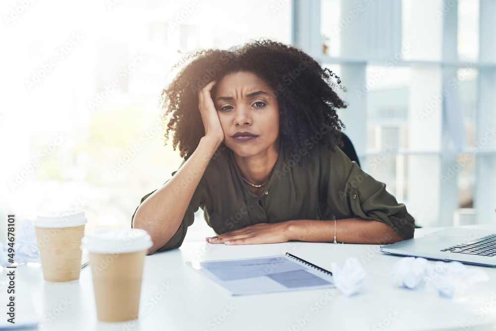 Running out of ideas is normal, just never give up. Portrait of a young businesswoman sitting at her office desk looking tired and stressed out. Running out of ideas is normal, just never give up. Portrait of a young businesswoman sitting at her office desk looking tired and stressed out.