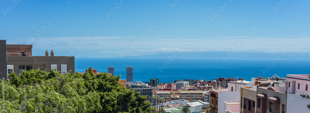 Panoramic view of Santa Cruz de Tenerife with the island of Gran Canaria in the background on a sunny day. Canary Islands.
