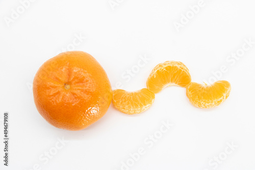 selective focus Tangerine or komola in a plate isolated on white background, top view
