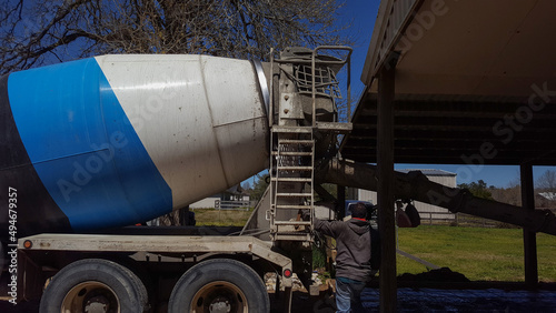 A cement truck delivering concrete at a construction site