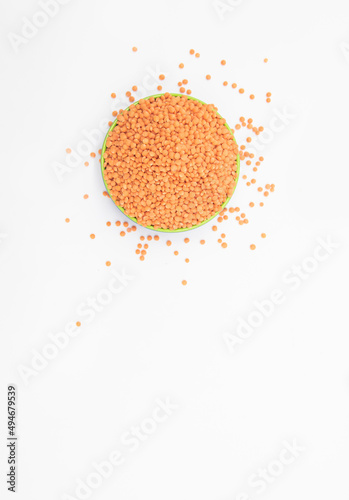 Red lentils pile isolated on white background, also known as raw daal, masoor dhal, top view