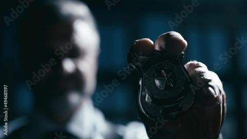 Police officer showing his badge on camera, making arrest, talking to witnesses photo