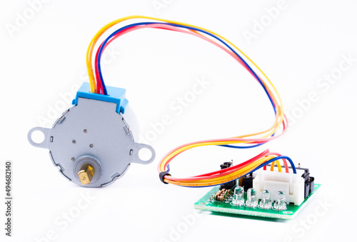 Detail of stepper motor and controller for arduino isolated on white background.