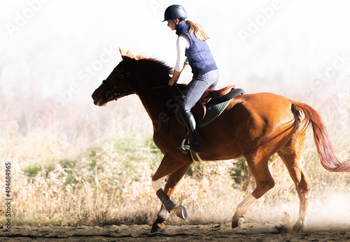 Young girl riding a horse © Dusan Kostic