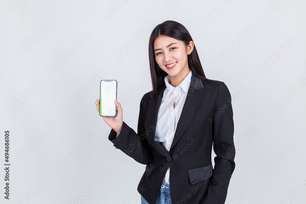business asian woman wearing office clothing successful hold smart phone mobile and computer laptop , Technology communication lifestyles concept. business asian woman wearing office clothing successful hold smart phone mobile and computer laptop , Technology communication lifestyles concept.