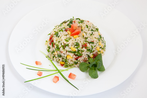 White rice mixed with colorful vegetables. Rice and vegetables in plate