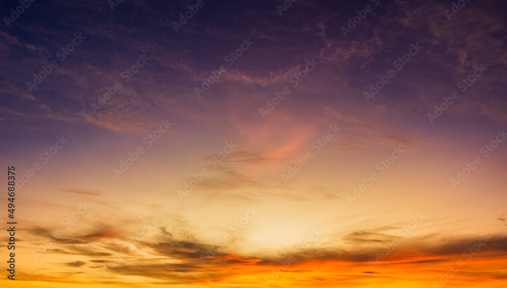 Sunset sky in the evening on twilight with orange sunlight clouds, Dusk sky background 