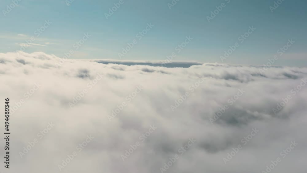 Aerial view flying over dense low cloud during the day. Aerial time lapse Real sky. Dream concept and weather forecast Aerial view flying over dense low cloud during the day. Aerial time lapse Real sky. Dream concept and weather forecast