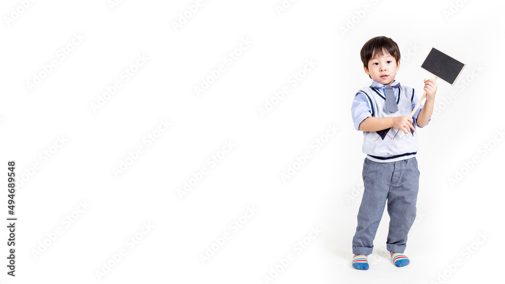 little boy holding a sign on white background. little boy holding a sign on white background.