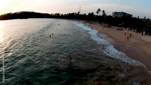 Wallpaper Mural Aerial Drone Over Popular And Busy Tourist Beach At Sunset In Mirissa Sri Lanka With People Swimming Torontodigital.ca