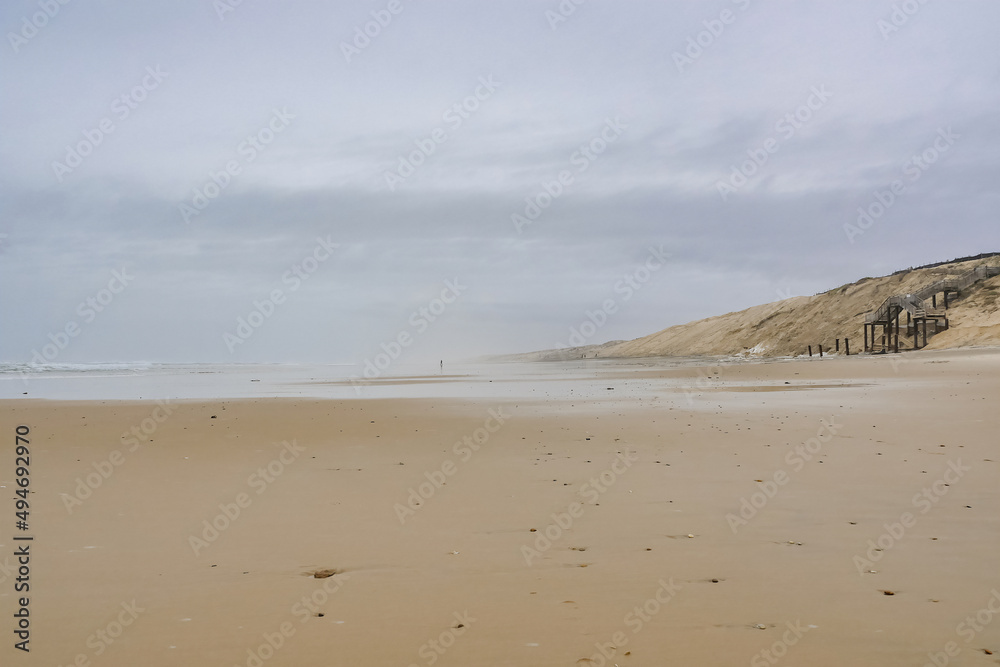 Walking alone on the sand, loneliness, homecoming