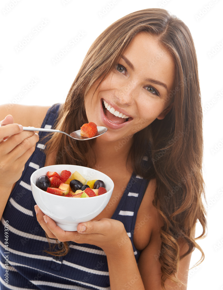 Healthy diet. A pretty young woman enjoying a bowl of fruit salad. Healthy diet. A pretty young woman enjoying a bowl of fruit salad.