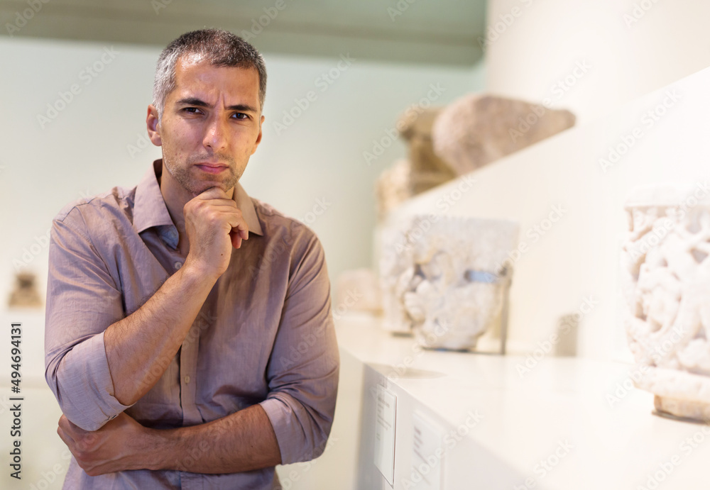 © JackF - Man is looking at the exposition in the museum. © JackF - Man is looking at the exposition in the museum.
