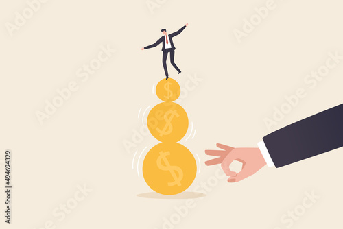 A businessman tries to keep his balance by walking on gold coins. financial and business risks and liabilities Stability or balance of economics and investments.