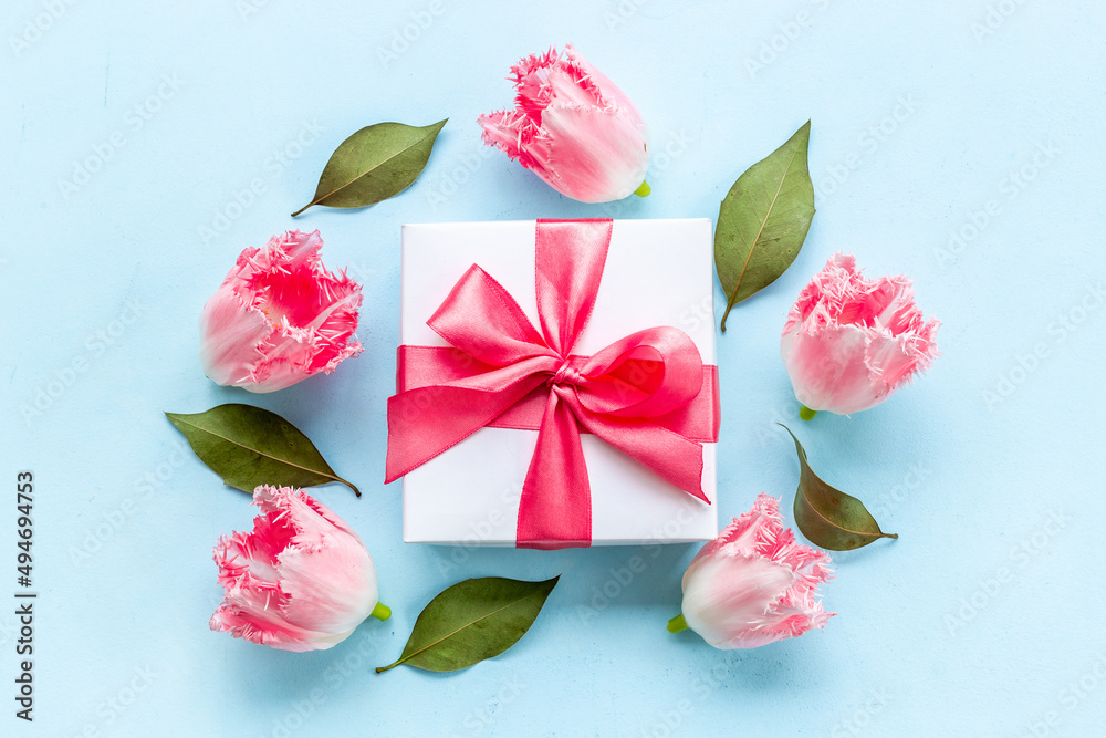 Happy Mothers day. Pink flowers with white gift box Happy Mothers day. Pink flowers with white gift box