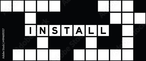 Alphabet letter in word install on crossword puzzle background