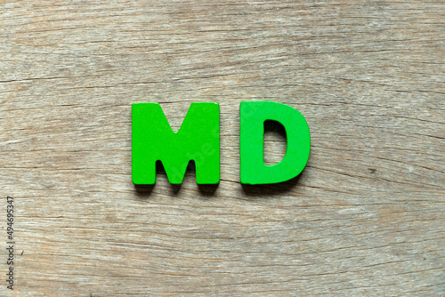 Wallpaper Mural Color alphabet letter in word MD (abbreviation of doctor of medicine or managing director) on wood background Torontodigital.ca
