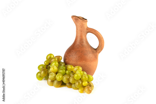 Georgian traditional clay vessel jug(doqi) for wine and grapes on white isolated background.