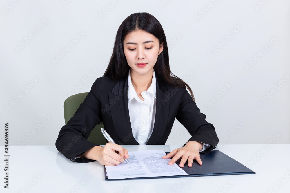 asian business woman working in office with documents. asian business woman working in office with documents.