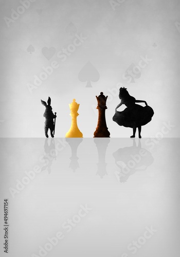 Photo Alice, the Rabbit and chess pieces Queen and King