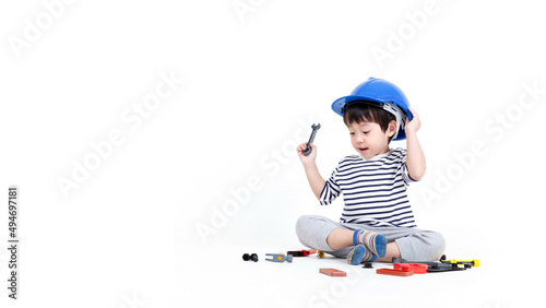 ittle boy playing act engineer, education concept. photo