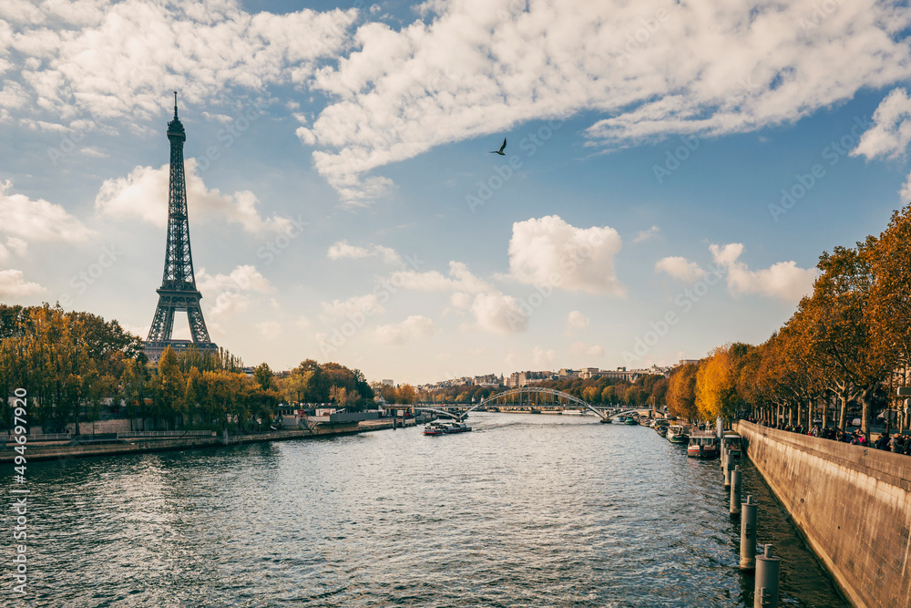 eiffel tower with blue sky and clouds in autumn