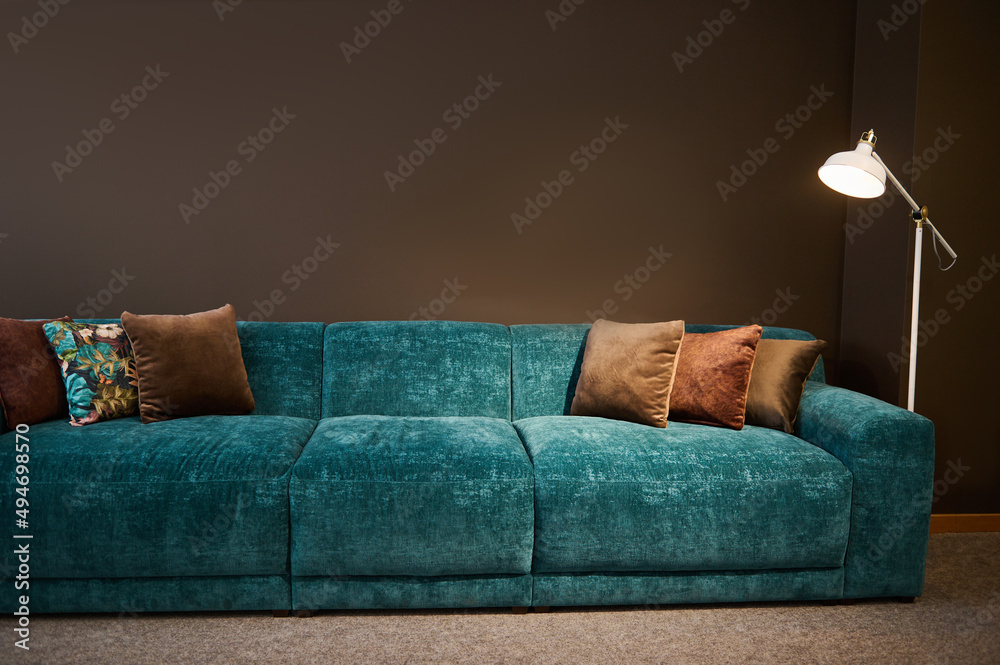Exhibition of modern stylish upholstered furniture in the showroom of a  furniture store. Focus on a