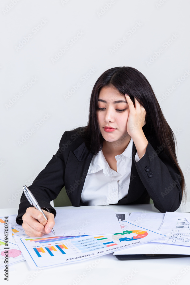 asian business woman working in office with documents. asian business woman working in office with documents.