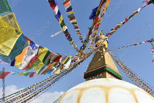 BOUDDHANATH stupa (wisdom eyes,golden pinnacle,umbrella,lotus and prayer flag and thirtheen steps) under the wind