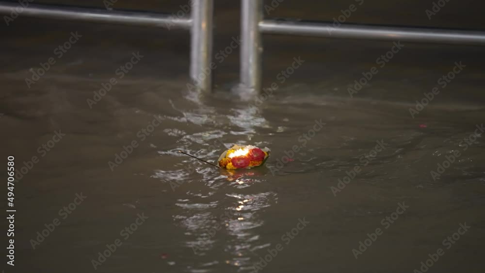 Floating Diyas With Flowers Offered To The Goddess Ganga During Aarti Ceremony In Rishikesh, India. Rack Focus
