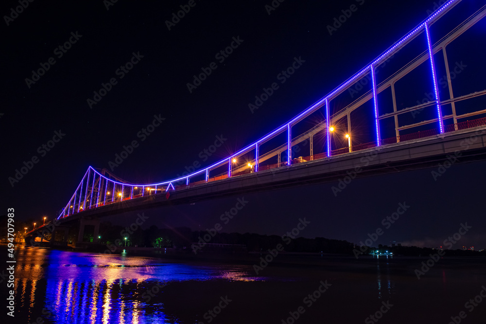 Night view of pedestrian bridge on Dnipro in Kiev Ukraine