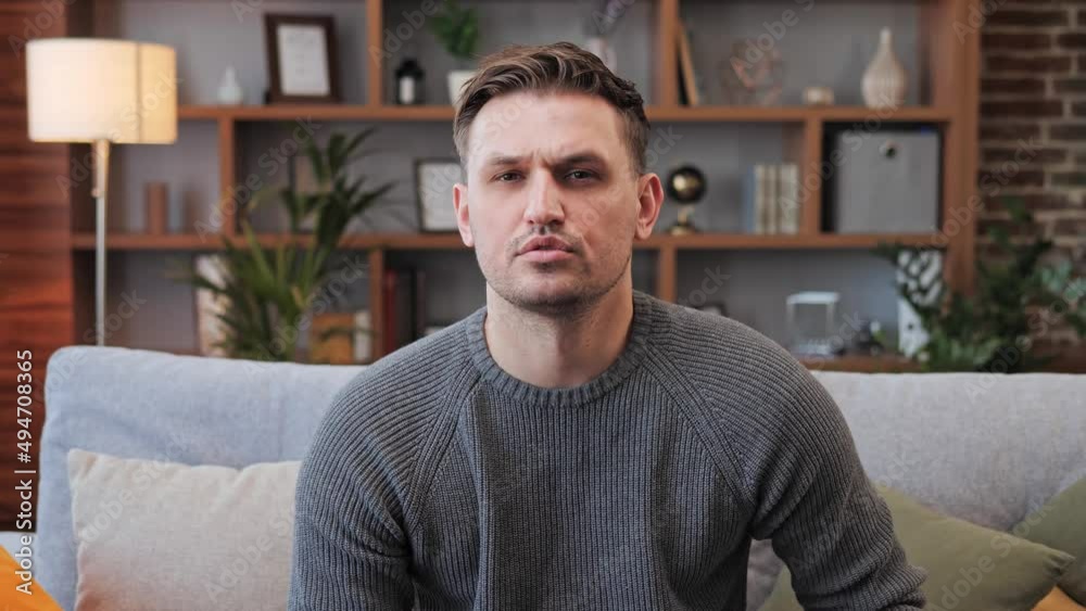 Attractive man wearing a casual clothes looking to camera talking to business partner agrees nods head through online connection conference. Distance communication concept video call. Attractive man wearing a casual clothes looking to camera talking to business partner agrees nods head through online connection conference. Distance communication concept video call.