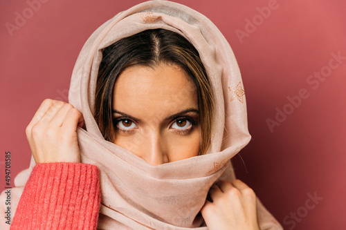 Attractive arab woman in headscarf in studio photo