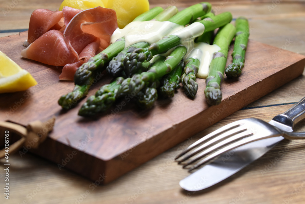 Green asparagus with Parma ham withe sauce hollandaise Green asparagus with Parma ham withe sauce hollandaise