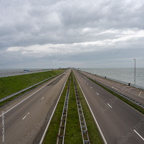 The Afsluitdijk is a major dam and causeway in the Netherlands. It is a fundamental part of the larger Zuiderzee Works, damming off salt water of the North Sea, and turning it into a freshwater lake